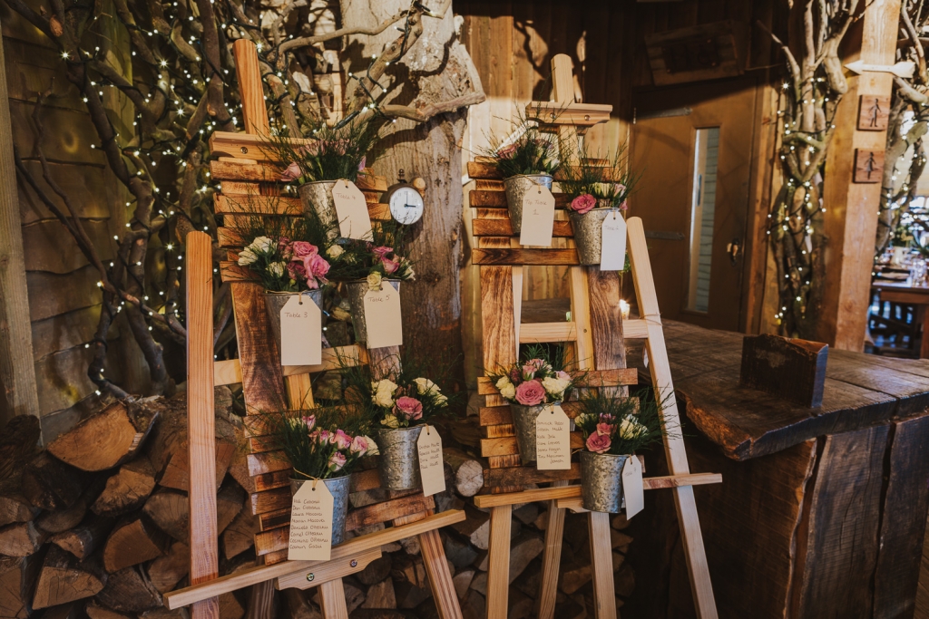 Alnwick Treehouse inside showing flower board feature at wedding