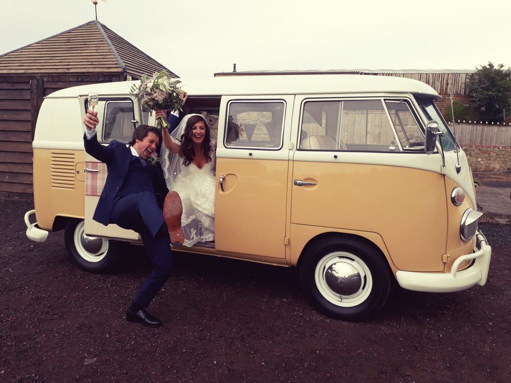 Campervan outside of The South Causey Inn with Bride and Groom in Celebration Pose